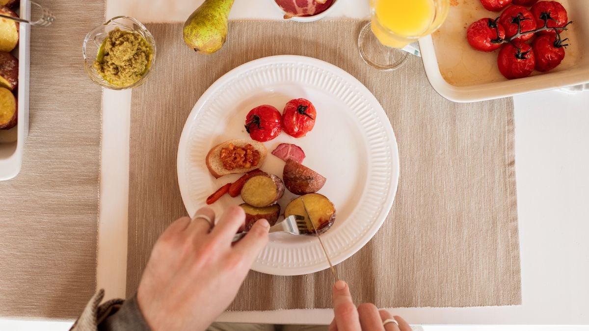 A top-down view of a colorful and tasty lunch with vegetables and fruit.